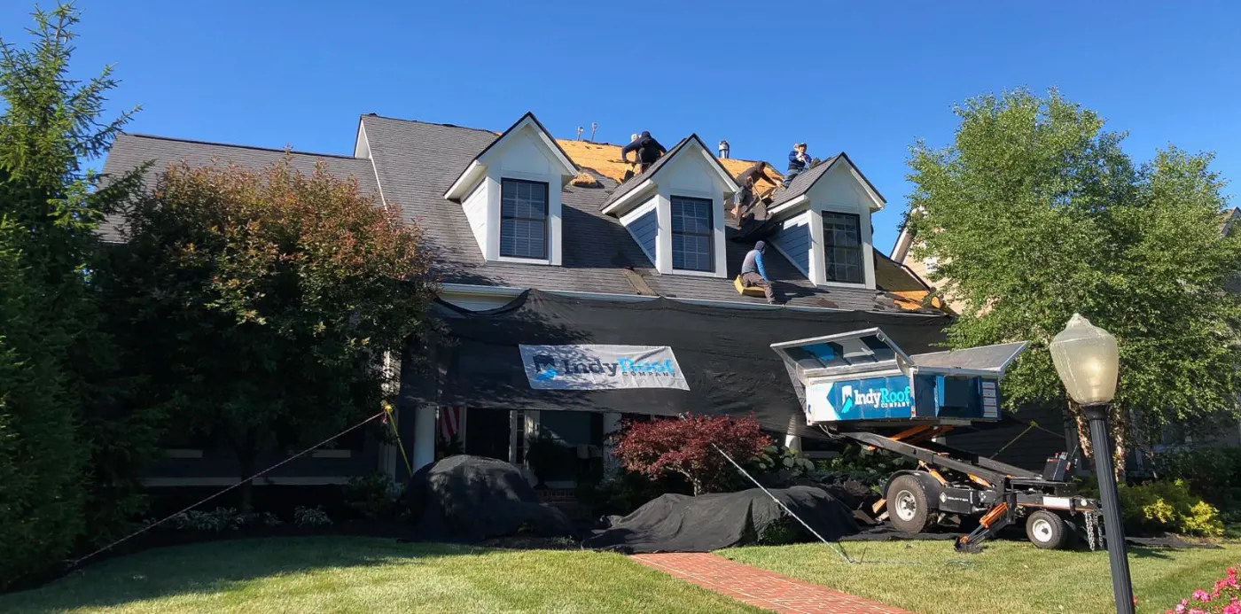Tarping and dry-in on a Glen Oaks Commons commercial roof